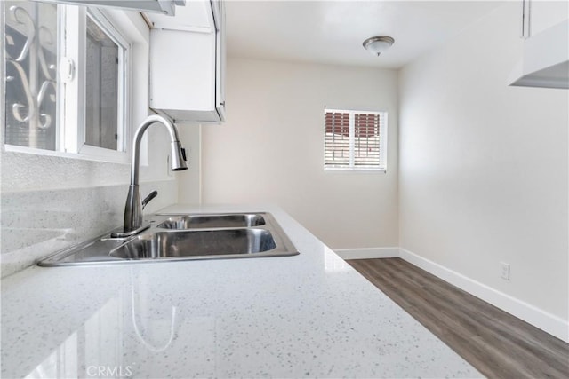 916 W 88th St, Los Angeles, CA 90044 - kitchen featuring a sink, baseboards, white cabinets, and dark wood-type flooring