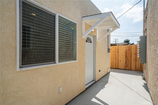 doorway to property with a patio