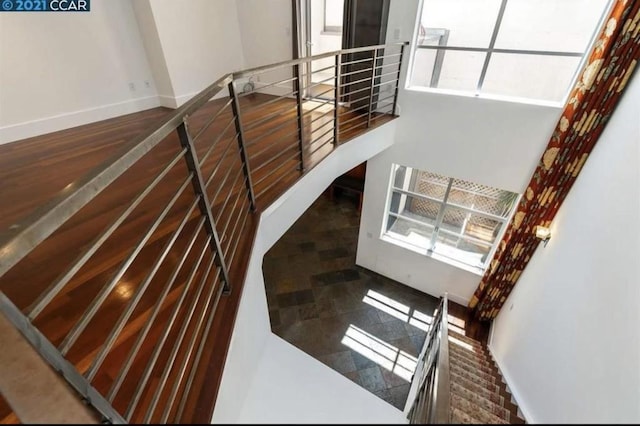 stairs with hardwood / wood-style flooring