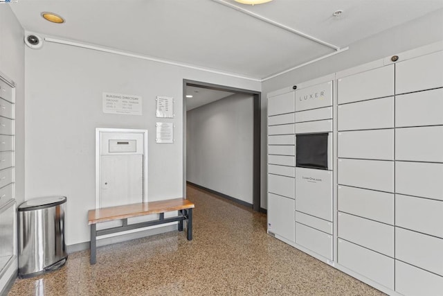 interior space with a package area and white cabinets