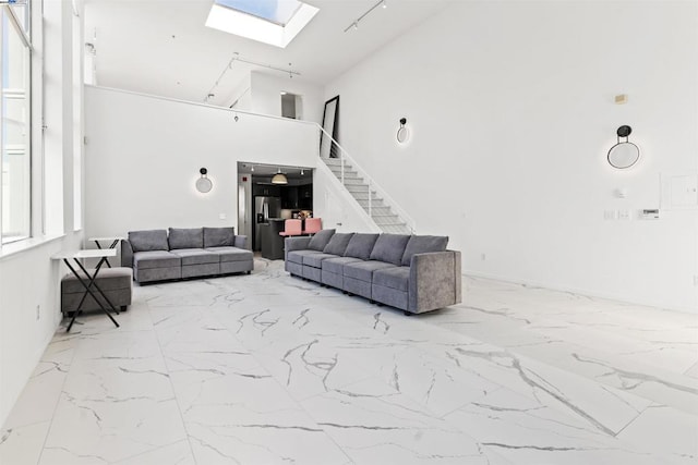 living room with a towering ceiling