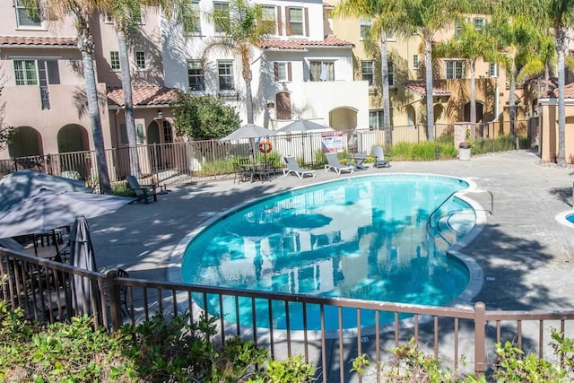 view of swimming pool featuring a patio