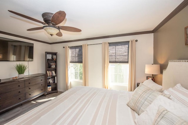 bedroom featuring ornamental molding and ceiling fan