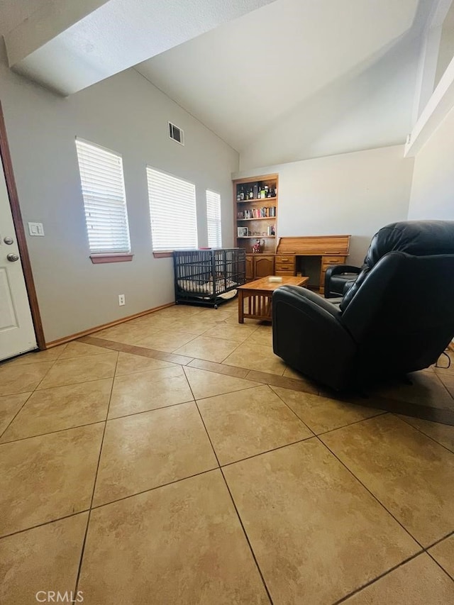 tiled living room featuring vaulted ceiling