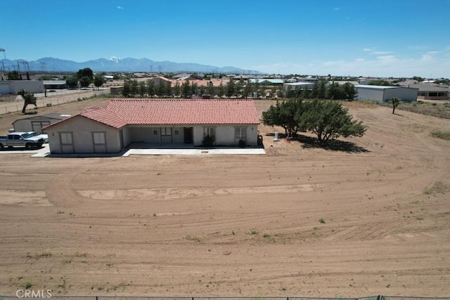 birds eye view of property featuring a mountain view