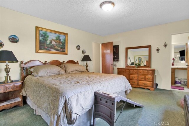 carpeted bedroom with a textured ceiling