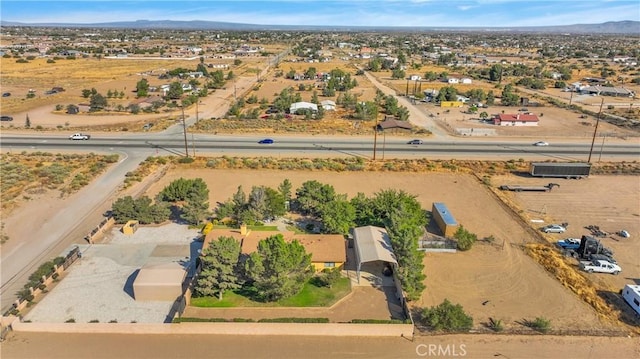 birds eye view of property featuring a mountain view