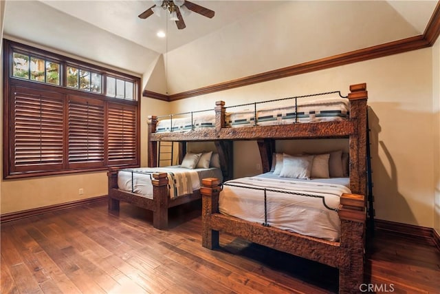 bedroom with ceiling fan, lofted ceiling, and hardwood / wood-style flooring