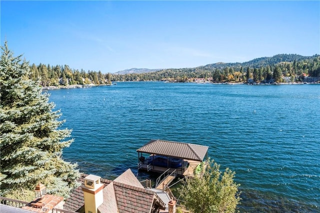 view of dock featuring a water and mountain view