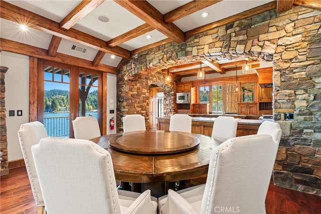 dining room featuring french doors, dark hardwood / wood-style flooring, and beamed ceiling