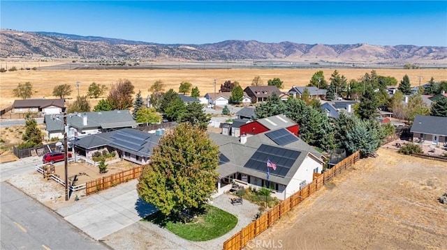 birds eye view of property featuring a mountain view