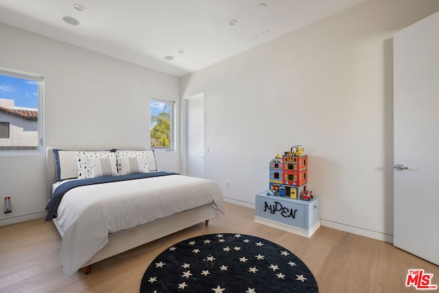 bedroom with light hardwood / wood-style floors