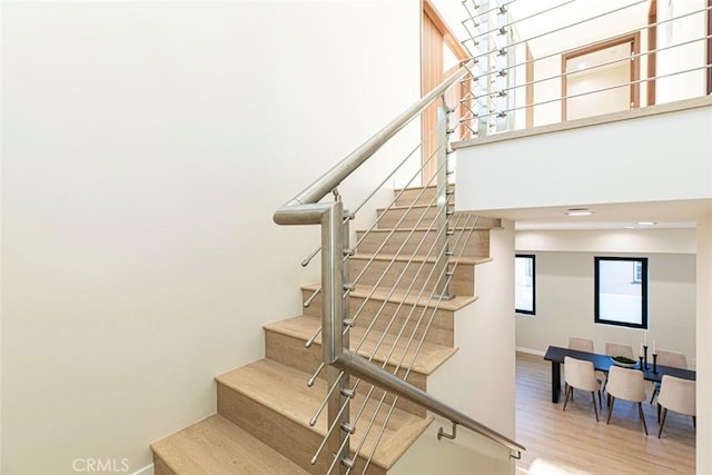 stairs with hardwood / wood-style flooring