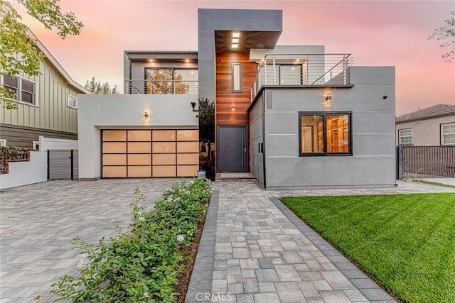 contemporary home with a balcony and a garage