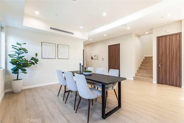 dining space with light wood-type flooring