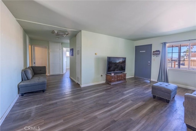 living room featuring dark wood-type flooring