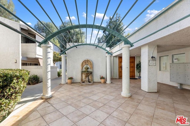 view of patio / terrace with a mail area