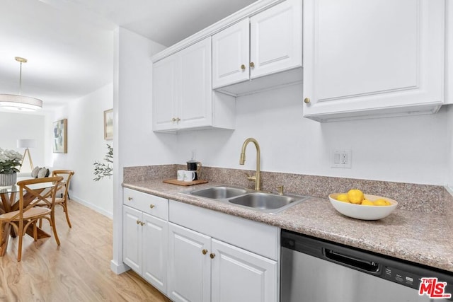 kitchen with white cabinets, sink, stainless steel dishwasher, light wood-type flooring, and decorative light fixtures