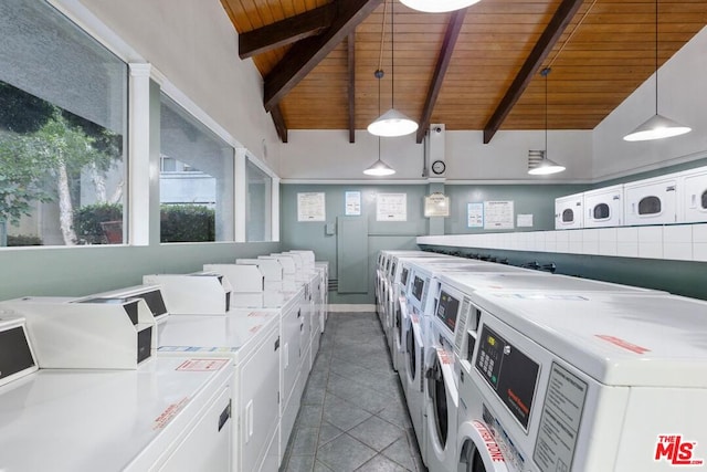 washroom featuring light tile patterned flooring, wooden ceiling, and washer and dryer