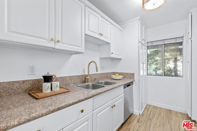 kitchen featuring white cabinetry, light hardwood / wood-style flooring, stainless steel dishwasher, and sink