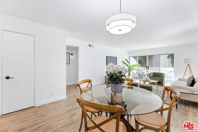 dining area with light wood-type flooring