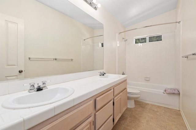 full bathroom featuring tile patterned floors, lofted ceiling, toilet, vanity, and tiled shower / bath