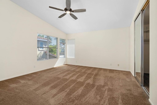 unfurnished bedroom featuring carpet floors, ceiling fan, and lofted ceiling