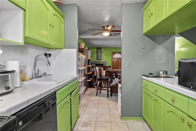 kitchen with tile counters, black dishwasher, light tile patterned flooring, and backsplash