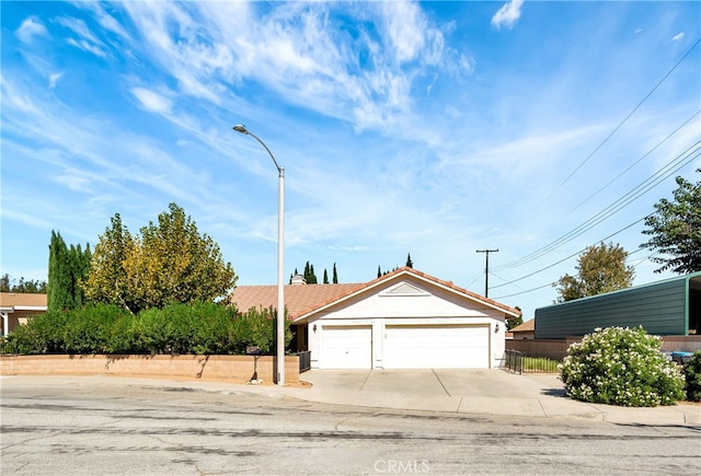 ranch-style house featuring a garage