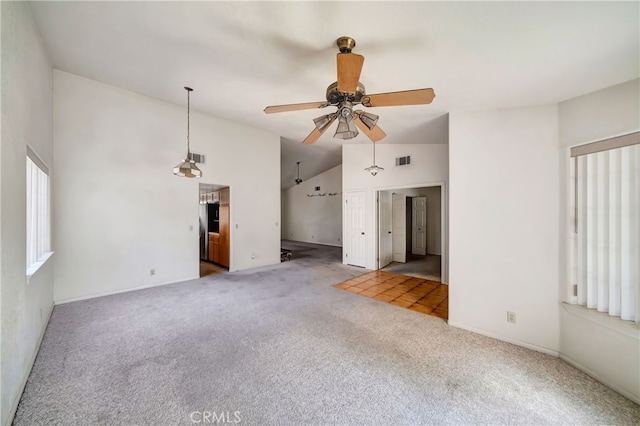 unfurnished living room featuring high vaulted ceiling, ceiling fan, and carpet floors