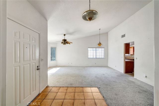 interior space featuring lofted ceiling and ceiling fan