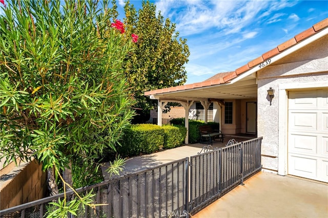 view of patio featuring a garage