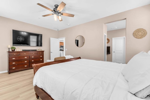 bedroom featuring light hardwood / wood-style floors and ceiling fan