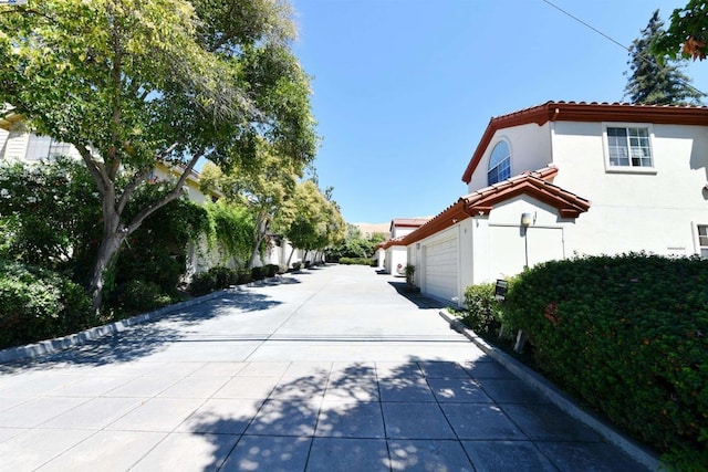 view of side of property featuring a garage