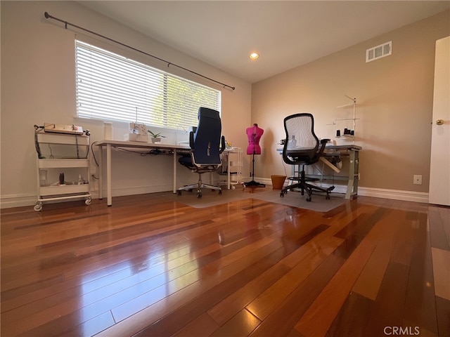 office space with wood-type flooring