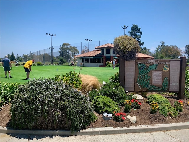 view of home's community with a lawn