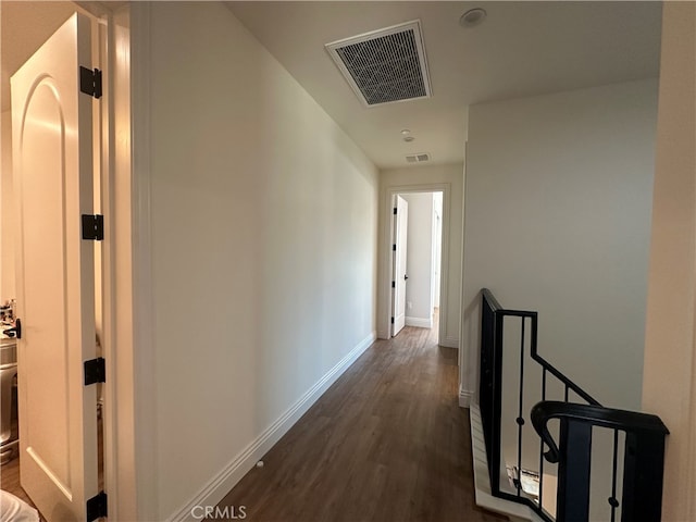 hallway featuring dark wood-type flooring