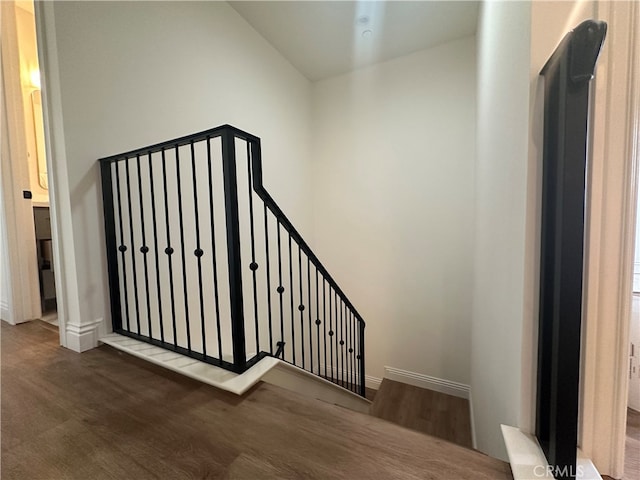 staircase featuring hardwood / wood-style floors