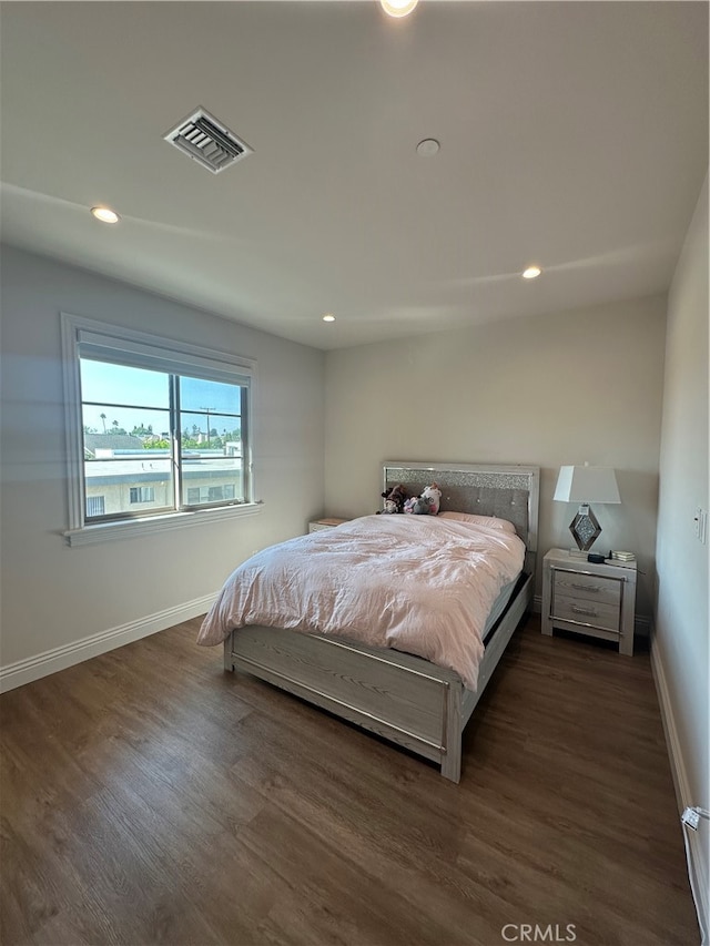 bedroom featuring dark wood-type flooring