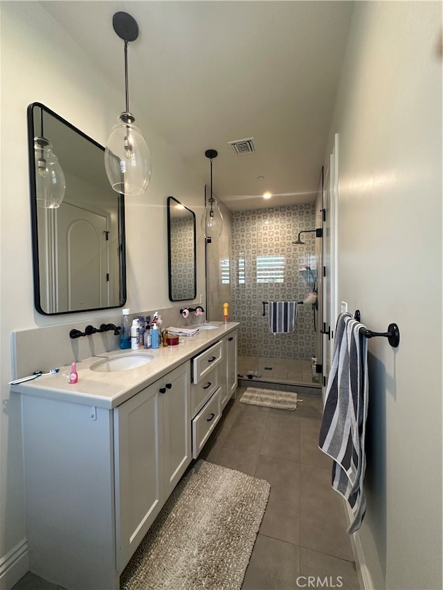 bathroom with walk in shower, tile patterned floors, and vanity