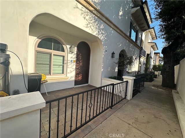 view of exterior entry with covered porch