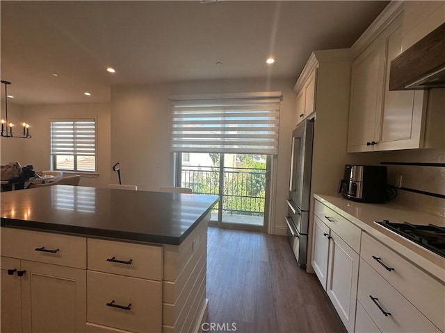 418UNITD W Fairview Ave Unit D, Arcadia, CA 91007 - kitchen with wall chimney exhaust hood, freestanding refrigerator, white cabinetry, dark wood-style flooring, and recessed lighting
