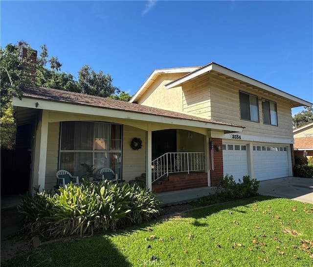 view of front of property featuring covered porch, a garage, and a front yard