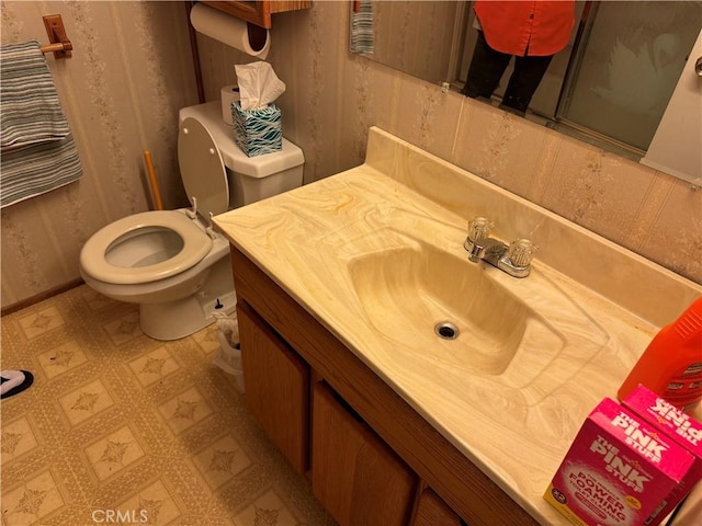 bathroom with vanity and toilet