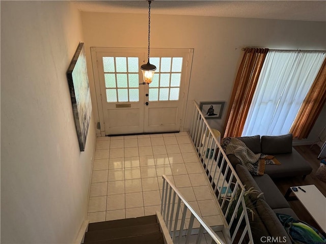 tiled foyer entrance with french doors