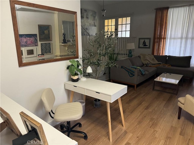 interior space with french doors and light hardwood / wood-style flooring