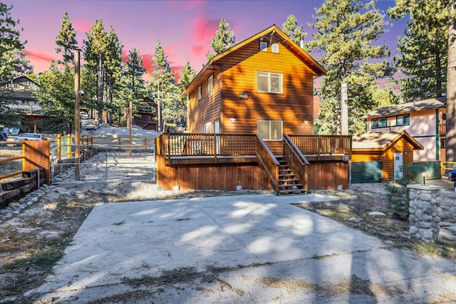 view of front of house with a wooden deck