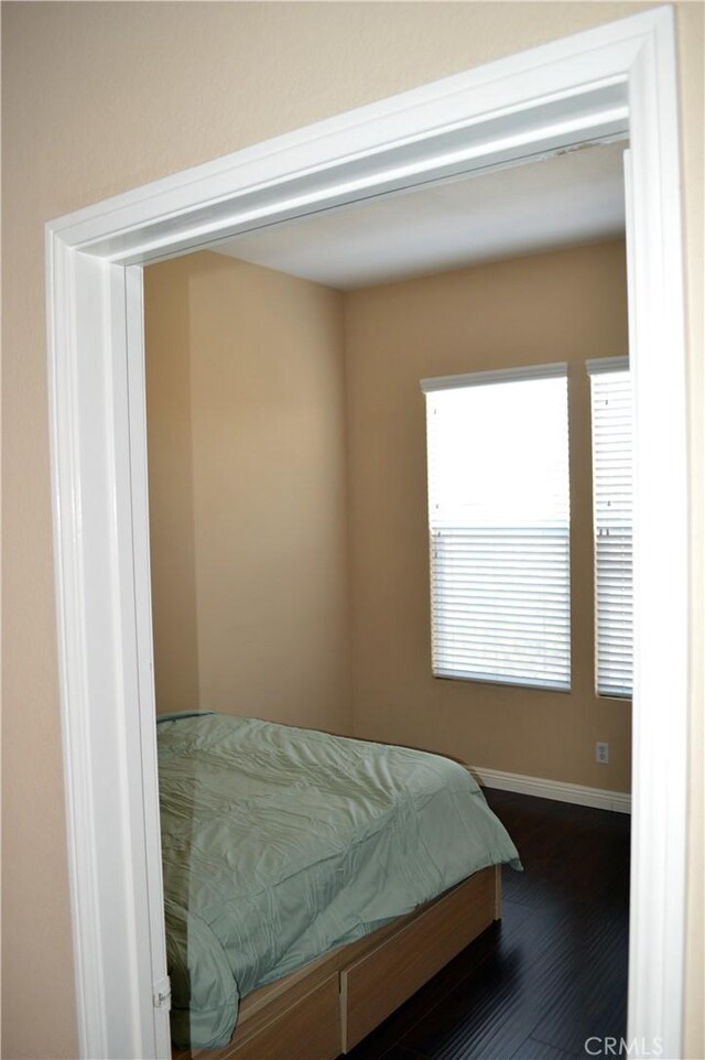 bedroom featuring dark hardwood / wood-style floors