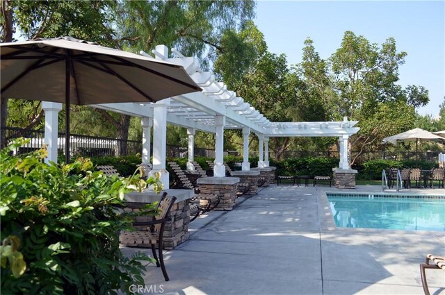 view of pool with a pergola and a patio