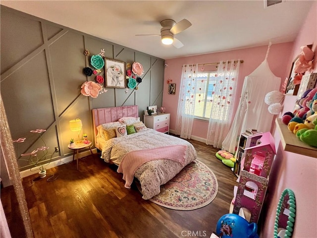 bedroom with ceiling fan and hardwood / wood-style floors